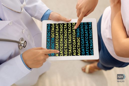 Physician and patient look at genomic data.